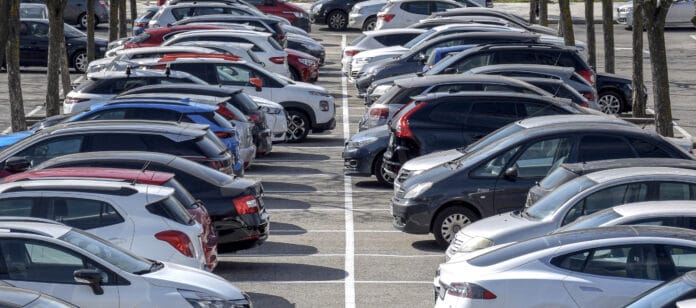 Facing car parking outside on a sunny day